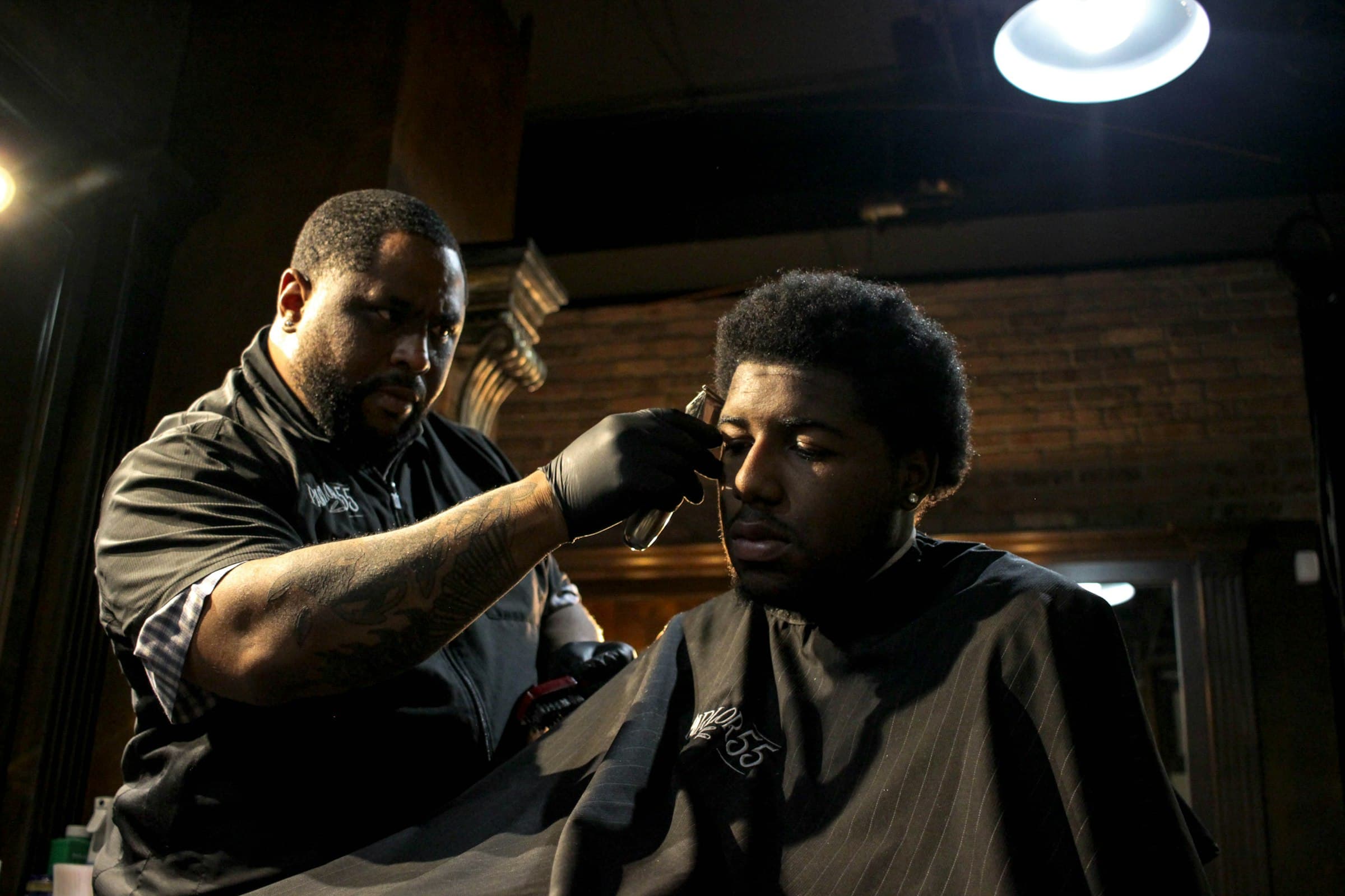 A barber with a customer