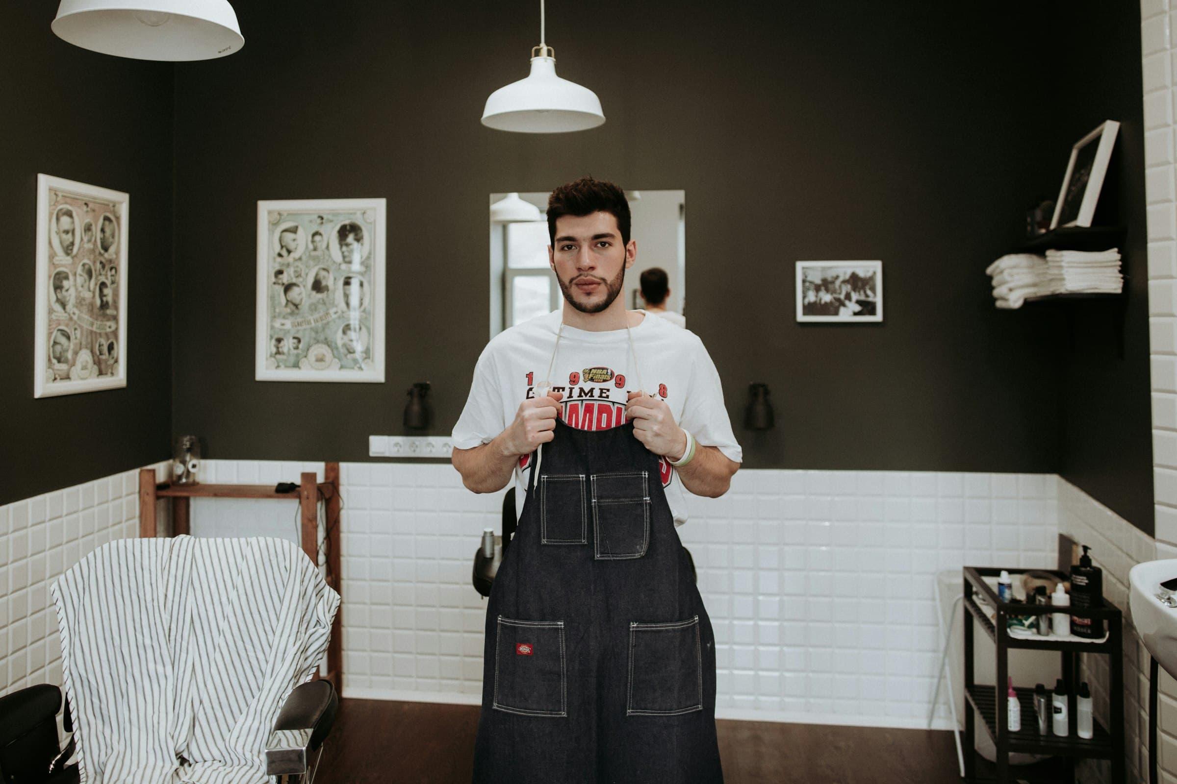 A new shop owner putting on his apron